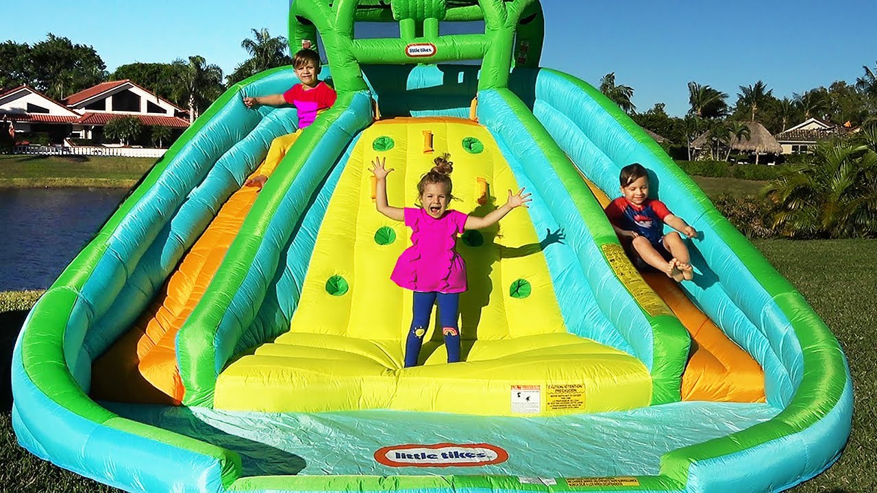 Diana and Roma pretend play with Inflatable water slide