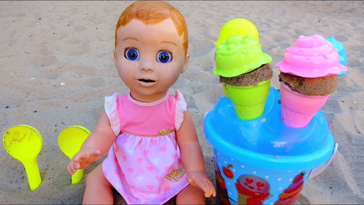 Baby doll playing with ice cream toys on the Playground. Video for kids